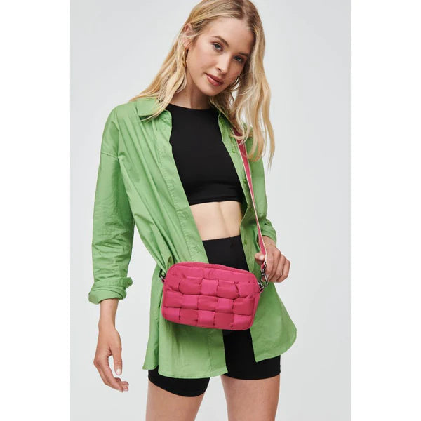 model wearing a pink crossbody bag