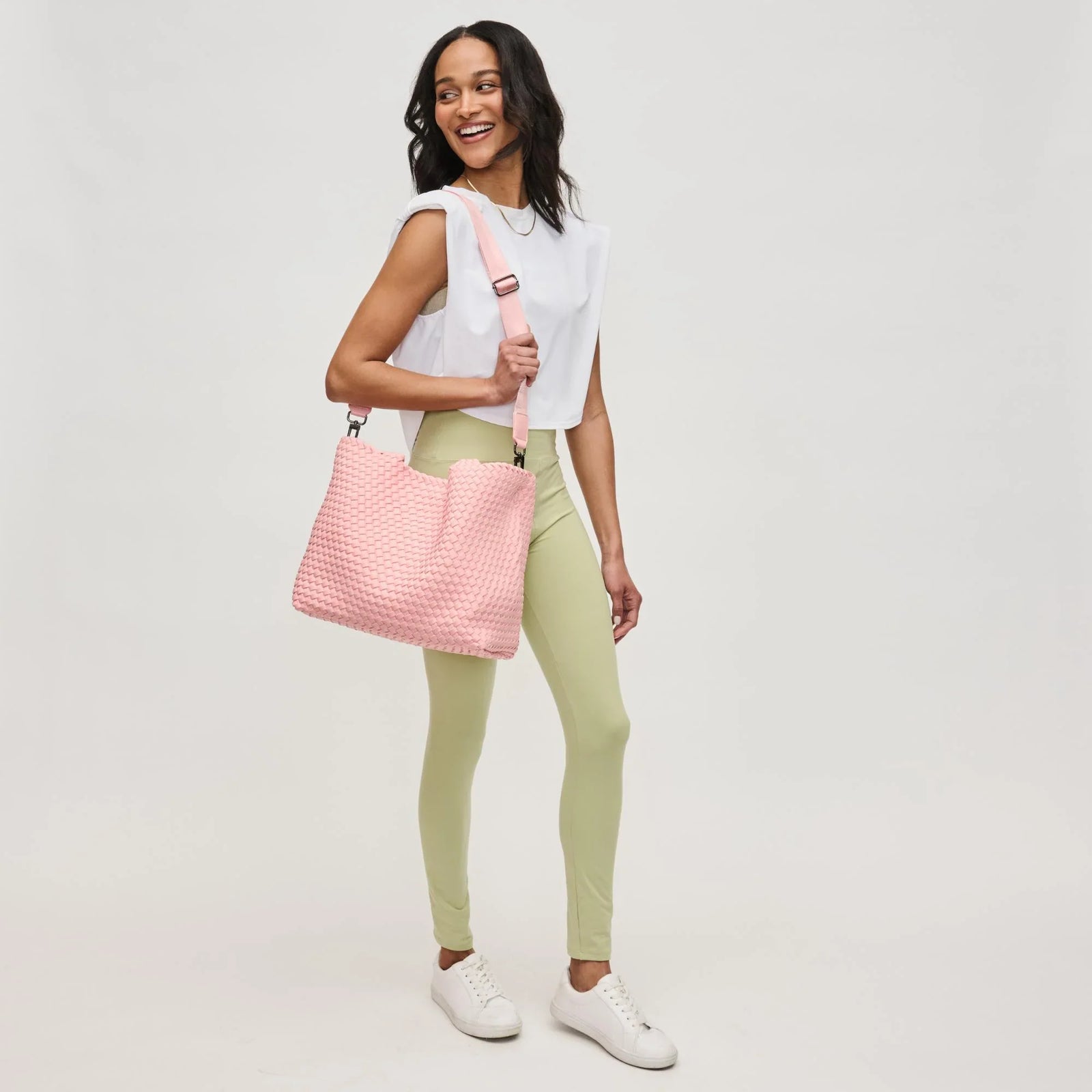 Woman with a pink handbag, ideal gifts for an active mom