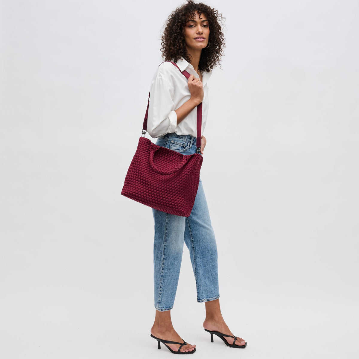 Woman wearing Wine Sol and Selene Sky's The Limit - Medium Tote 841764108850 View 4 | Wine