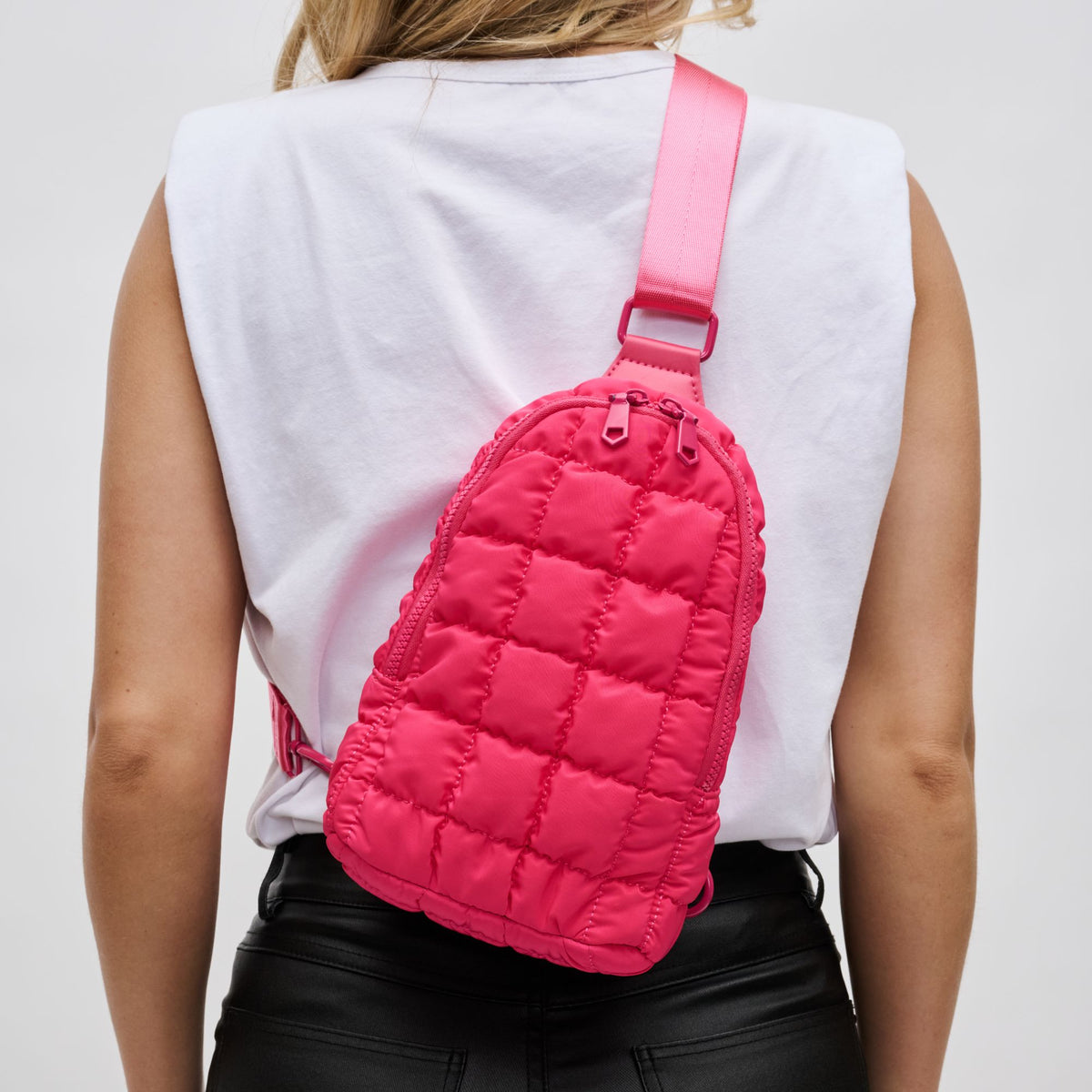 Woman wearing Hot Pink Sol and Selene Rejuvenate Sling Backpack 841764109611 View 4 | Hot Pink
