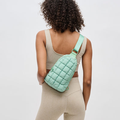 Woman wearing Pistachio Sol and Selene Rejuvenate Sling Backpack 841764109598 View 1 | Pistachio