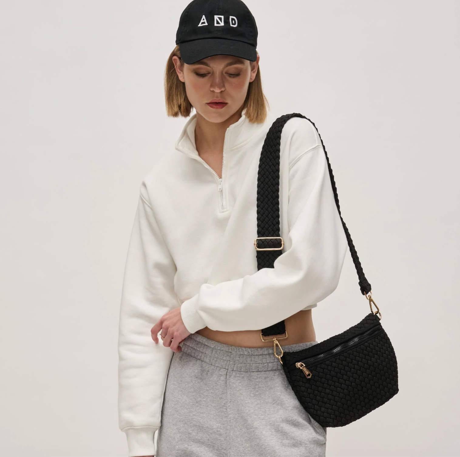 woman wearing a black crossbody bag