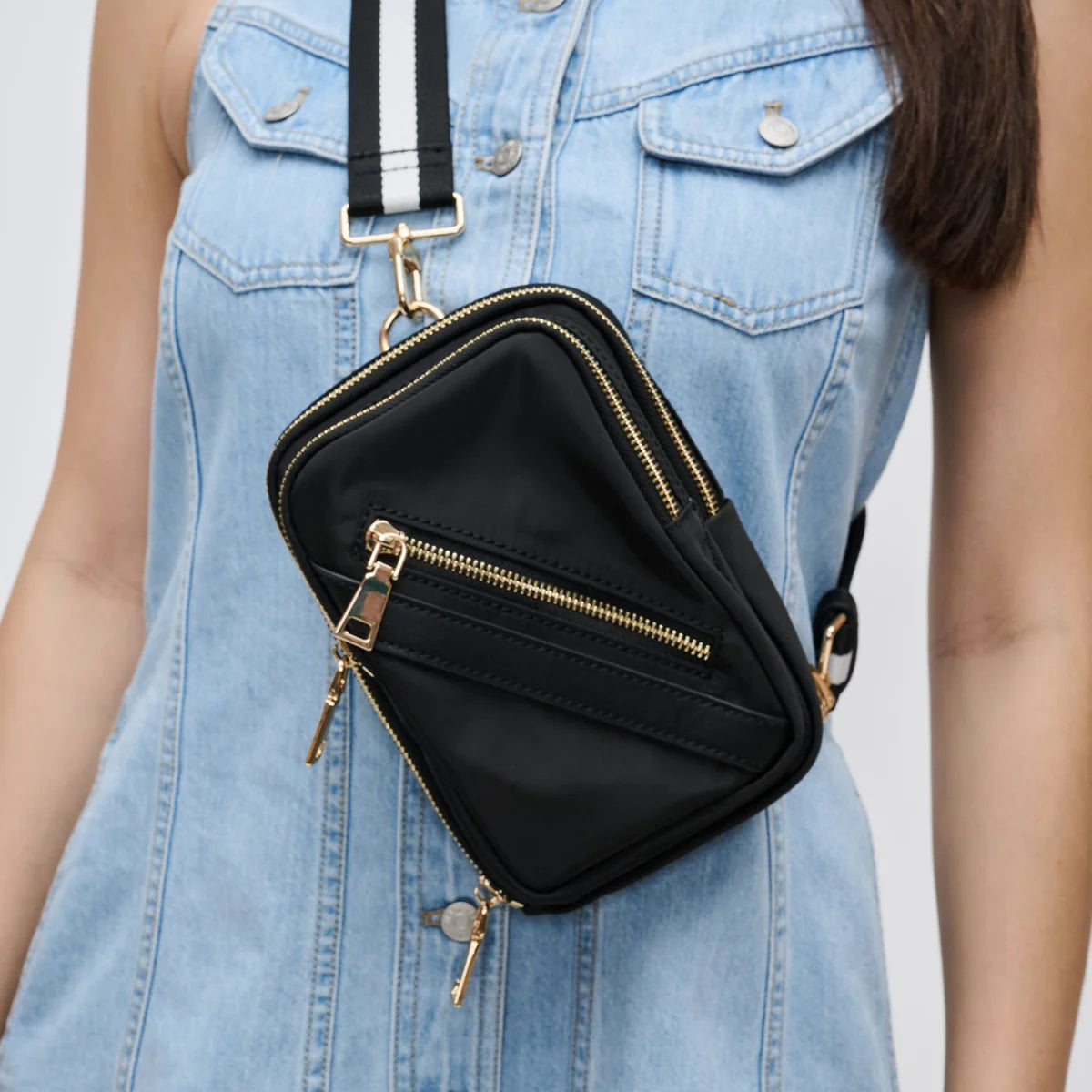 model wearing a black sling bag