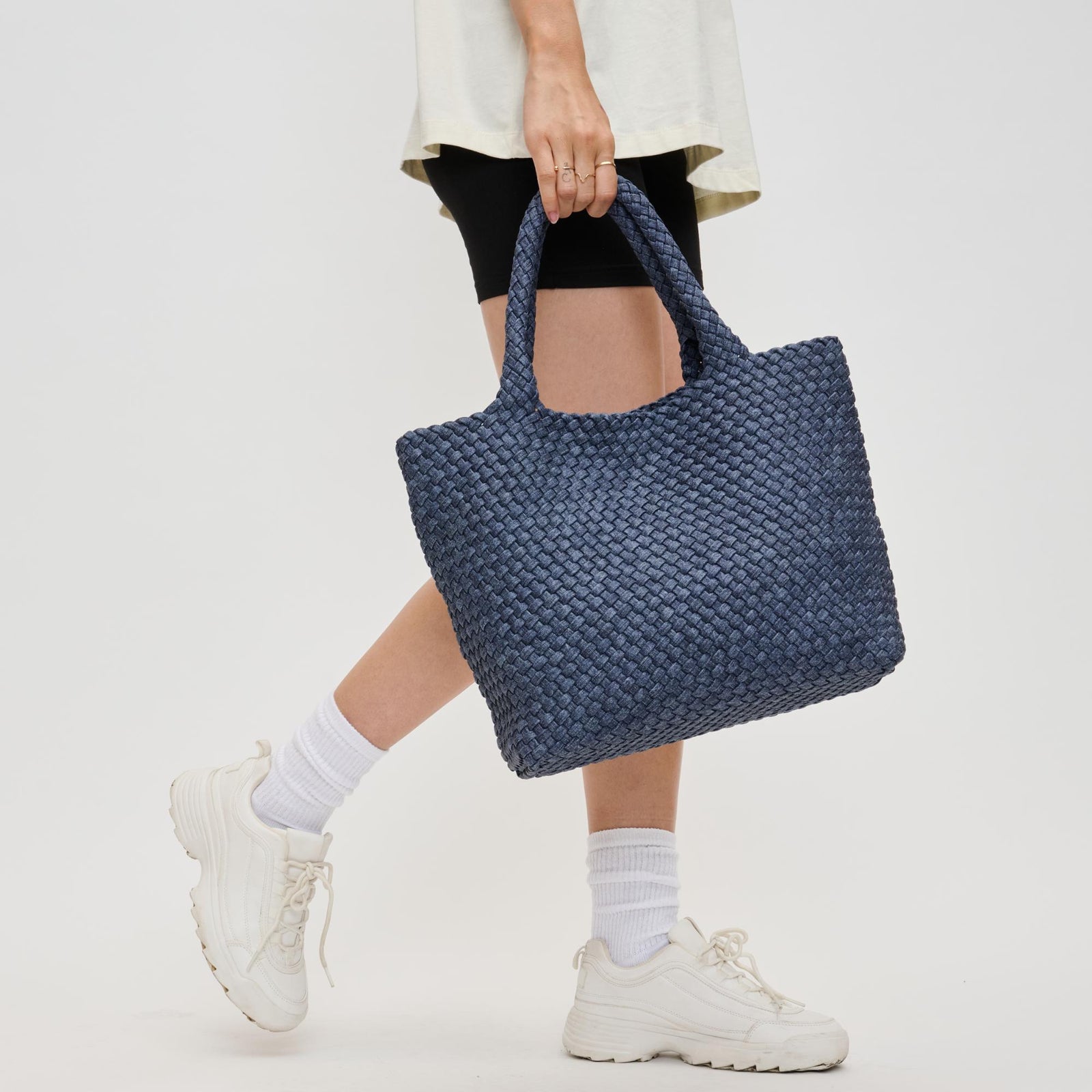woman with a denim tote bag