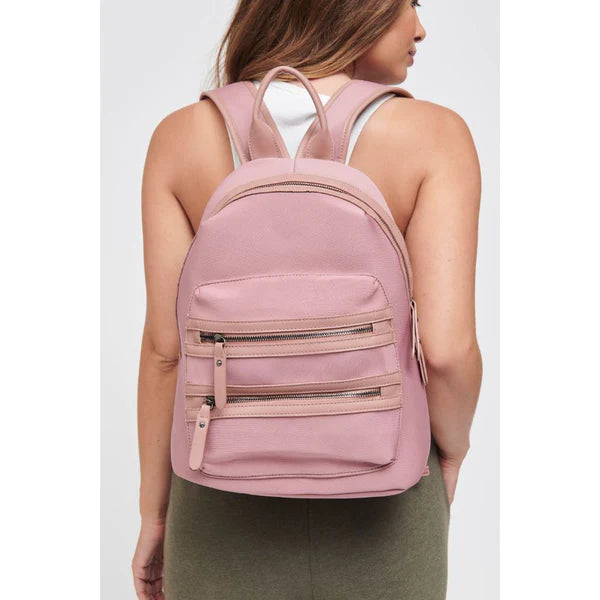 model wearing a mauve backpack