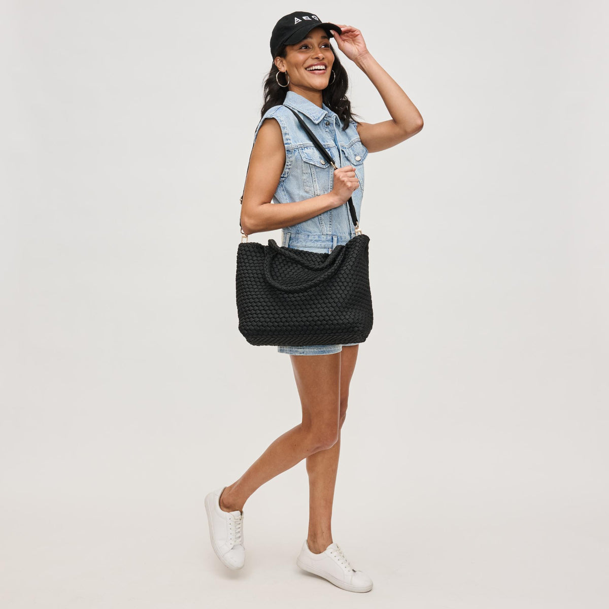 Woman wearing Black Sol and Selene Sky's The Limit - Medium Laced Up Eco-Edition Tote 841764111591 View 4 | Black