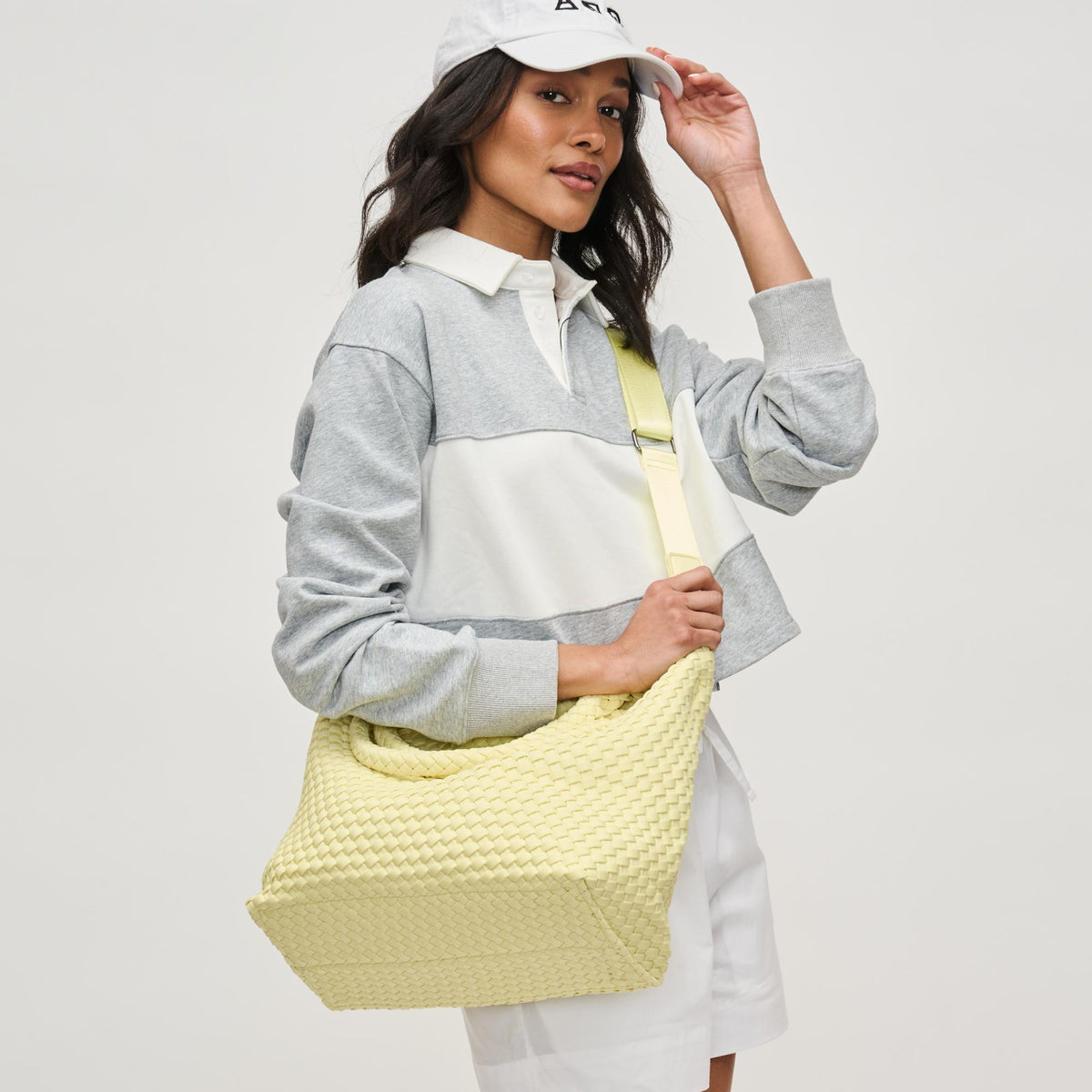 Woman wearing Butter Sol and Selene Sky's The Limit - Medium Tote 841764111287 View 1 | Butter