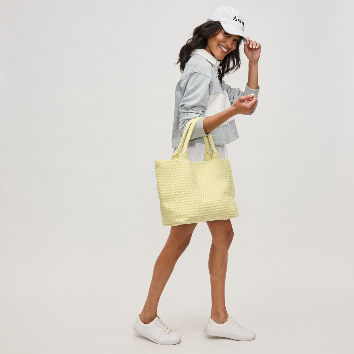 Woman wearing Butter Sol and Selene Sky's The Limit - Medium Tote 841764111287 View 3 | Butter