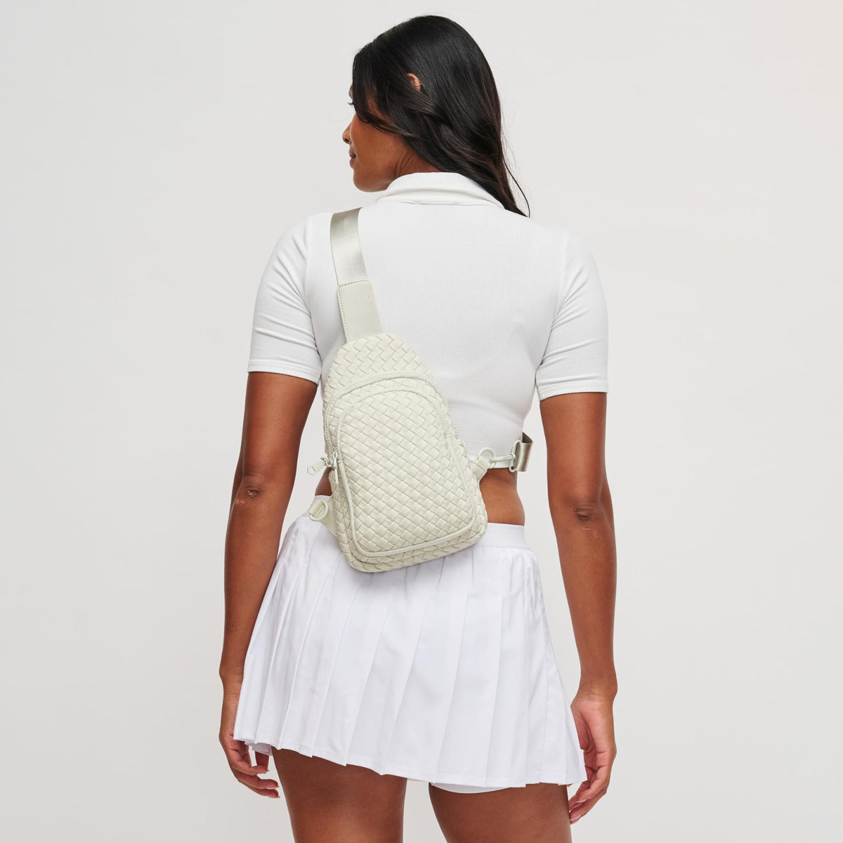 Woman wearing Bone Sol and Selene Beyond The Horizon - Woven Neoprene Sling Backpack 841764109062 View 2 | Bone