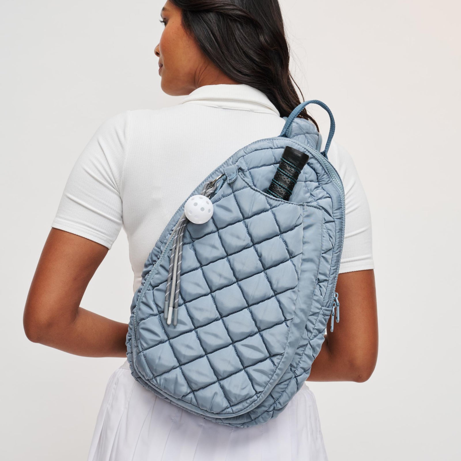 Woman wearing Black Sol and Selene Match Point - Quilted Puffer Pickleball & Paddle Tennis Sling Backpack 841764111973 View 1 | Black