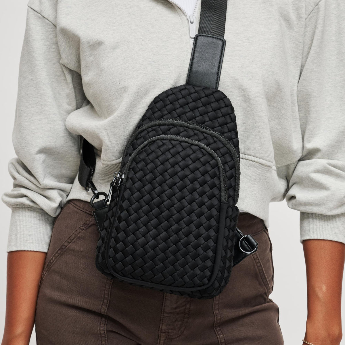 Woman wearing Black Sol and Selene Beyond The Horizon - Woven Neoprene Sling Backpack 841764108034 View 4 | Black
