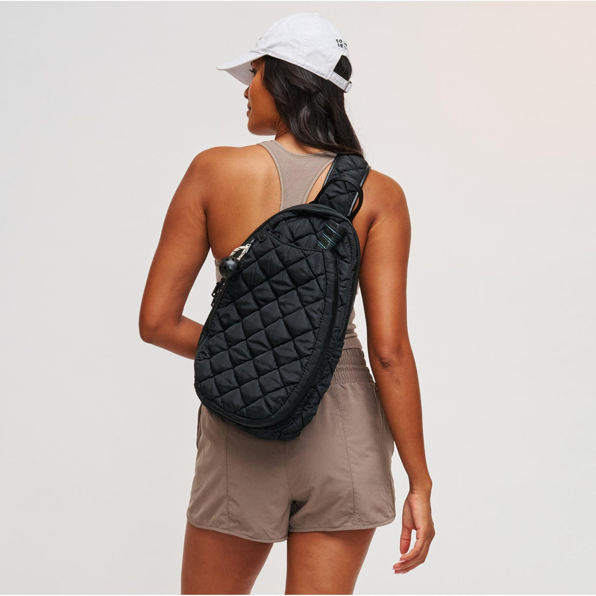 Woman wearing Black Sol and Selene Match Point - Quilted Puffer Pickleball & Paddle Tennis Sling Backpack 841764111973 View 2 | Black