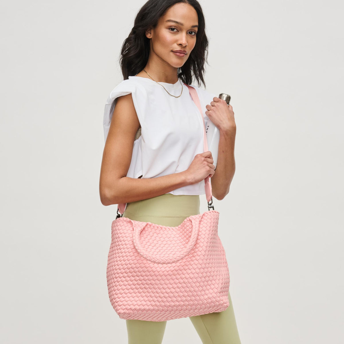 Woman wearing Blush Sol and Selene Sky's The Limit - Medium Tote 841764111270 View 3 | Blush