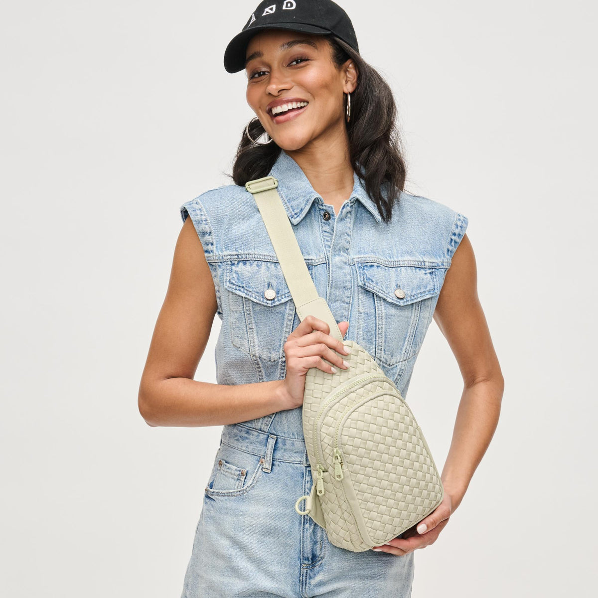 Woman wearing Sage Sol and Selene Beyond The Horizon - Woven Neoprene Sling Backpack 841764109086 View 2 | Sage