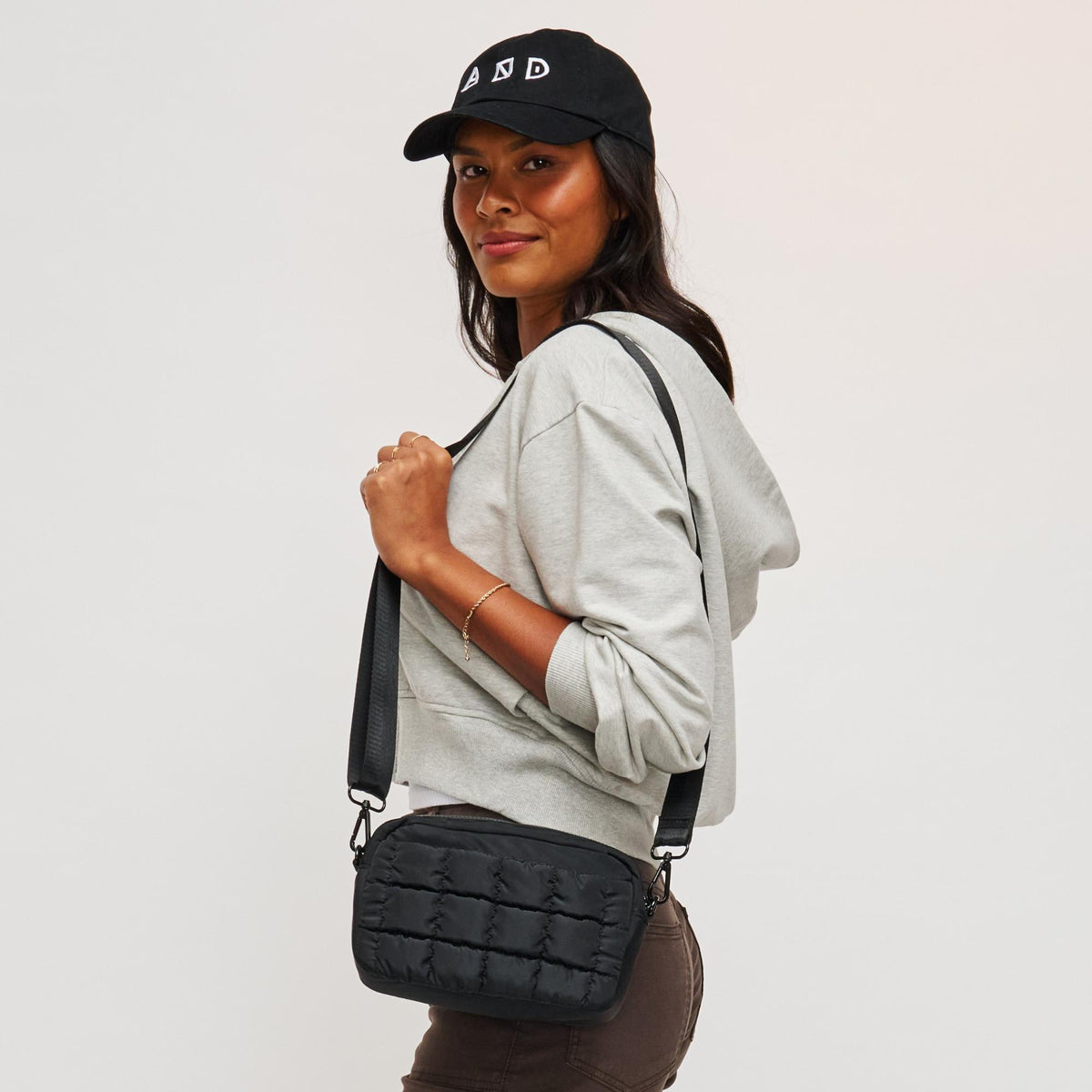 Woman wearing Black Sol and Selene Inspiration - Quilted Nylon Crossbody 841764108379 View 1 | Black