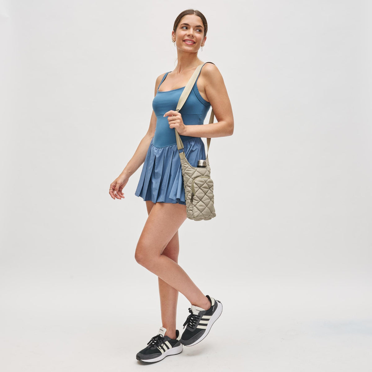 Woman wearing Desert Sage Sol and Selene Let It Flow - Puffer Crossbody 841764112086 View 3 | Desert Sage