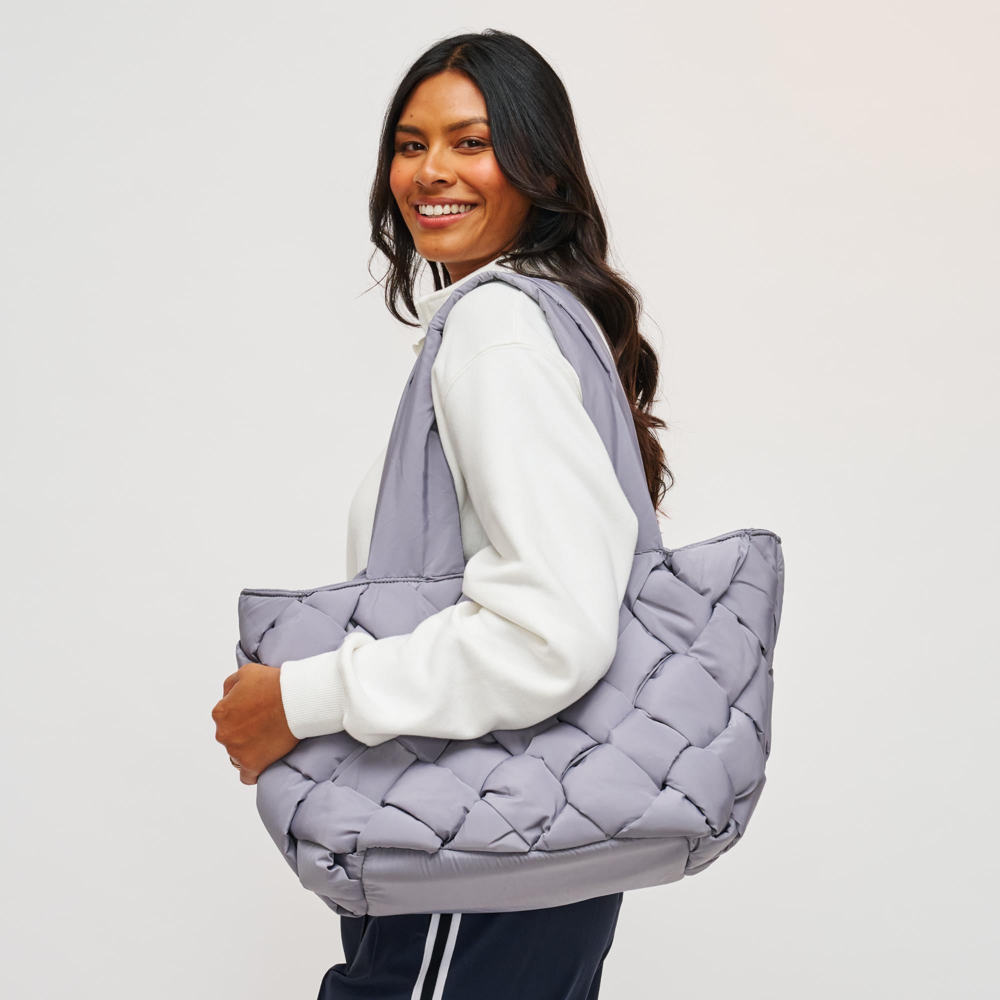 Woman wearing Black Sol and Selene Intuition East West Tote 841764107297 View 1 | Black