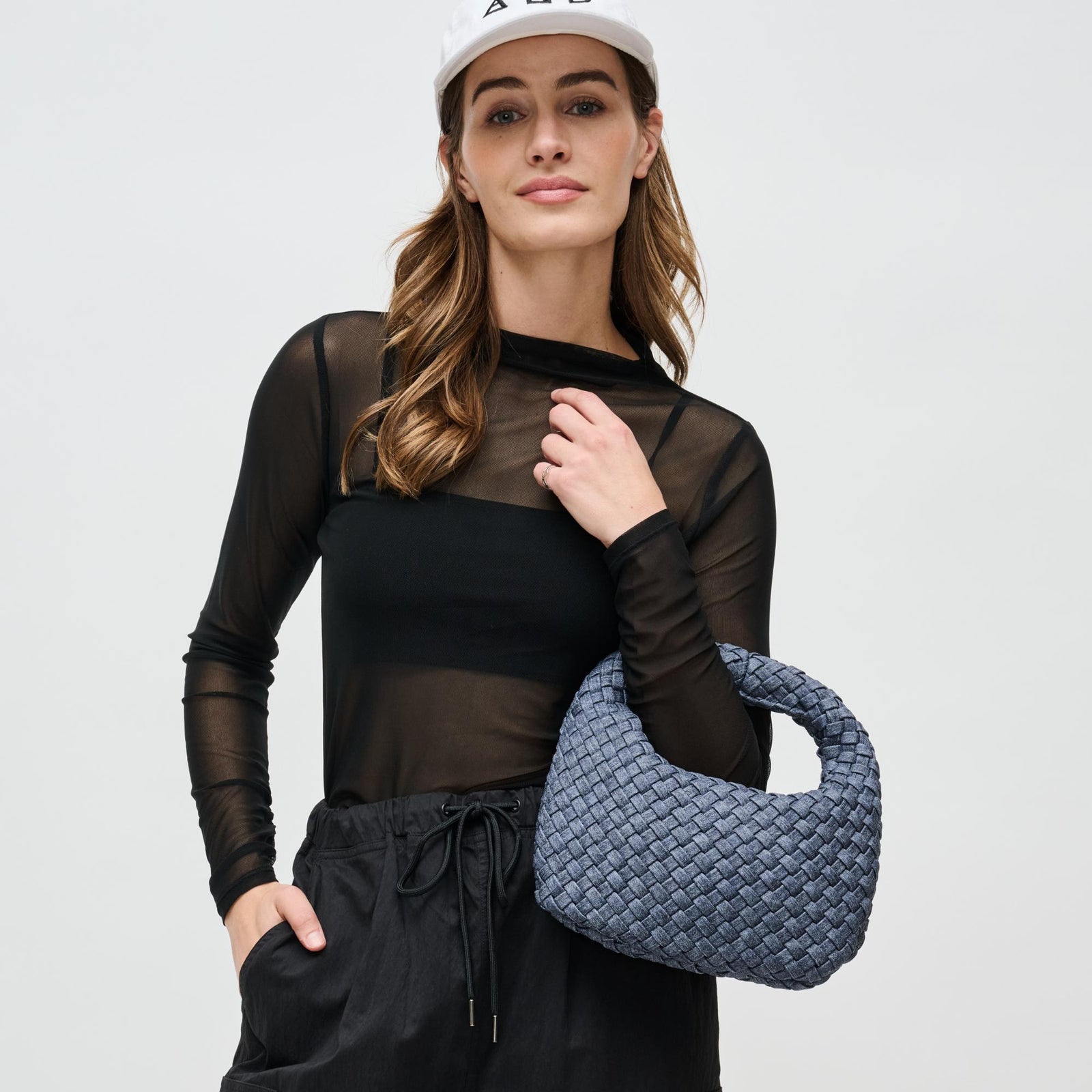 Woman wearing Black Sol and Selene Dare to Dream - Small Woven Neoprene Clutch 841764111072 View 1 | Black
