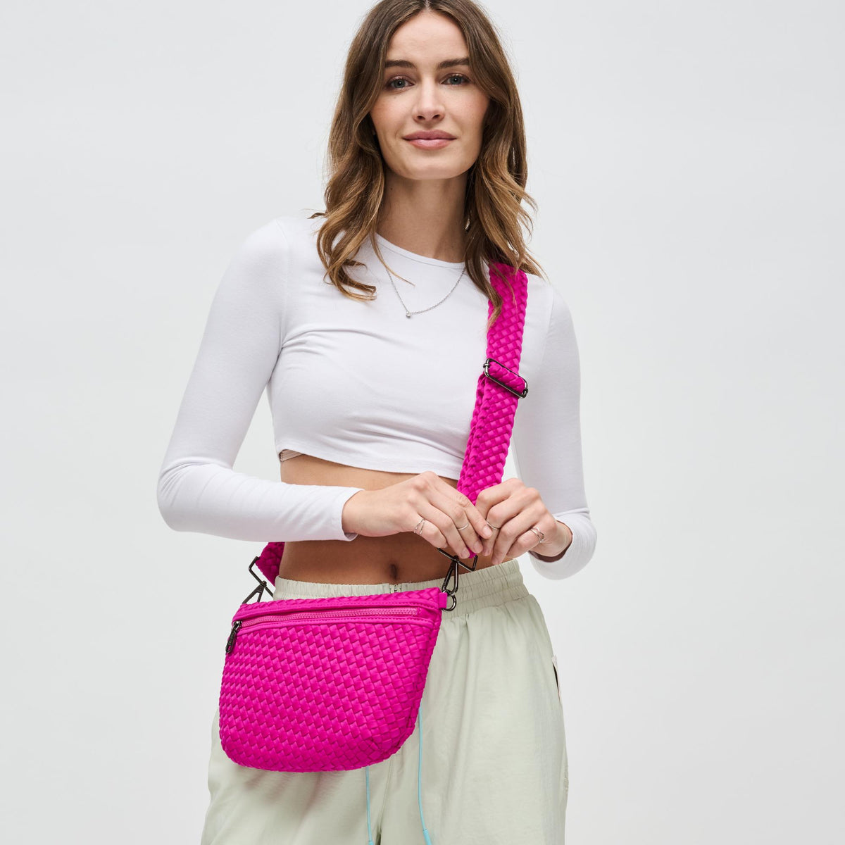 Woman wearing Fuchsia Sol and Selene Ethereal - Woven Neoprene Crossbody 841764110860 View 1 | Fuchsia