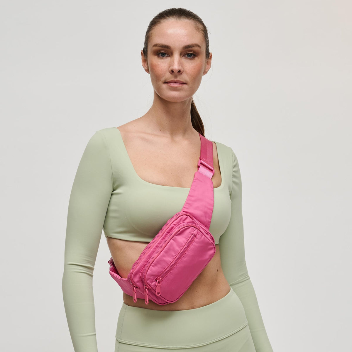 Woman wearing Mauve Sol and Selene Hip Hugger Belt Bag 841764108294 View 2 | Mauve