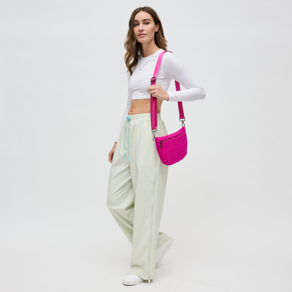 Woman wearing Fuchsia Sol and Selene Ethereal - Woven Neoprene Crossbody 841764110860 View 3 | Fuchsia