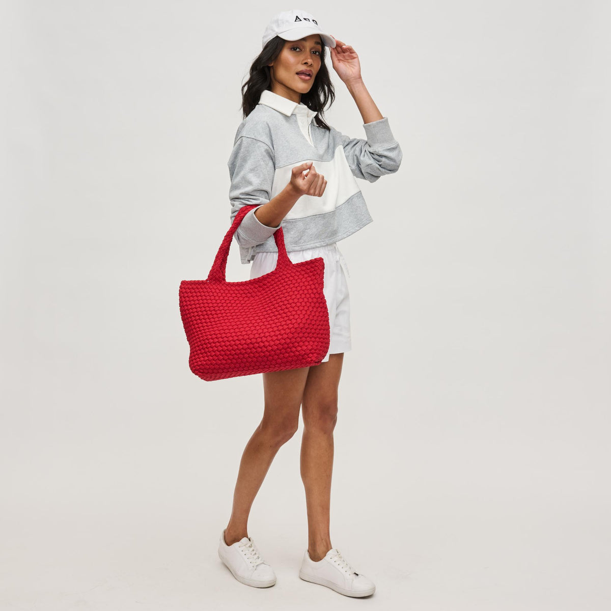Woman wearing Red Sol and Selene Sky's The Limit - Medium Laced Up Eco-Edition Tote 841764111645 View 2 | Red