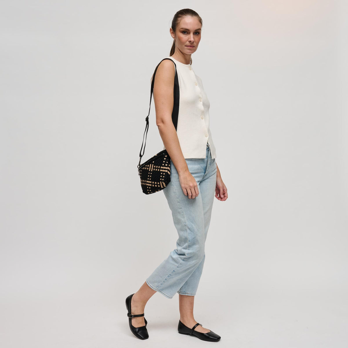 Woman wearing Black Nude Sol and Selene Ethereal - Woven Neoprene Crossbody 841764111768 View 3 | Black Nude