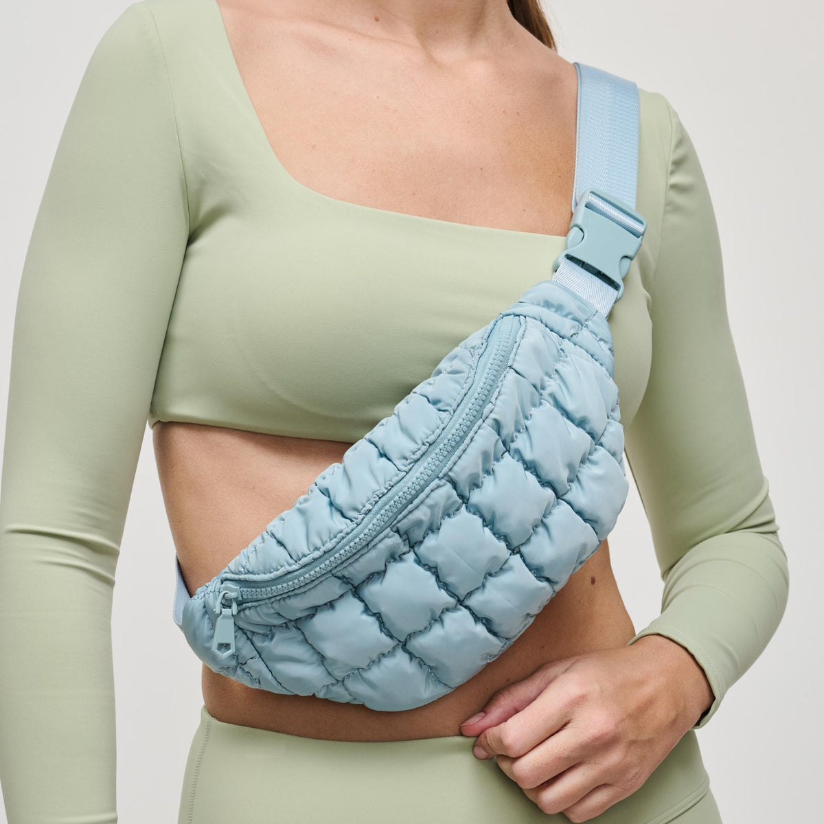 Woman wearing Sky Blue Sol and Selene Resurgence Belt Bag 841764109659 View 1 | Sky Blue