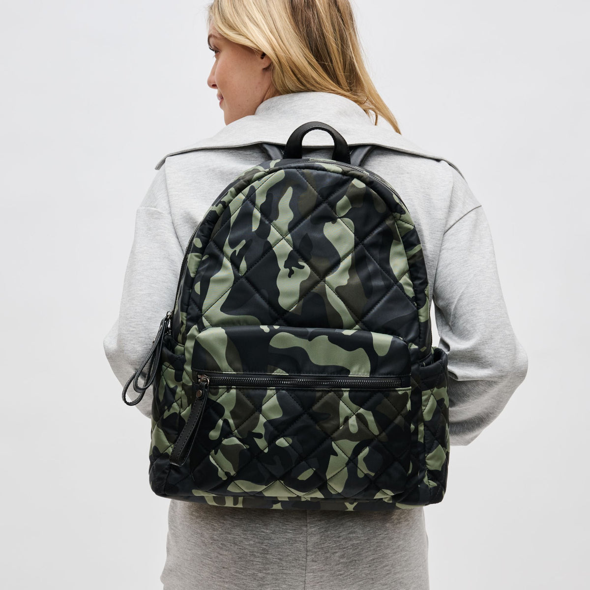 Woman wearing Camo Sol and Selene Motivator - Large Travel Backpack 841764106580 View 1 | Camo