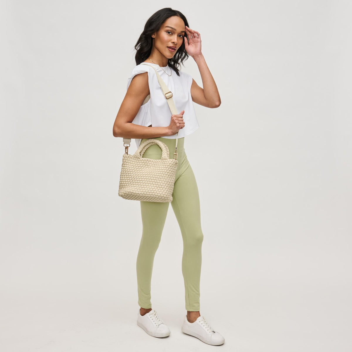 Woman wearing Beige Sol and Selene Sky's The Limit - Small Laced Up Eco-Edition Crossbody 841764111683 View 4 | Beige