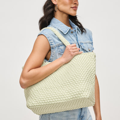 Woman wearing Pistachio Sol and Selene Sky's The Limit - Medium Laced Up Eco-Edition Tote 841764111638 View 1 | Pistachio