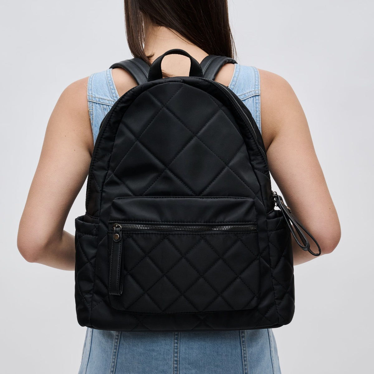 Woman wearing Black Sol and Selene Motivator - Medium Backpack 841764100076 View 1 | Black