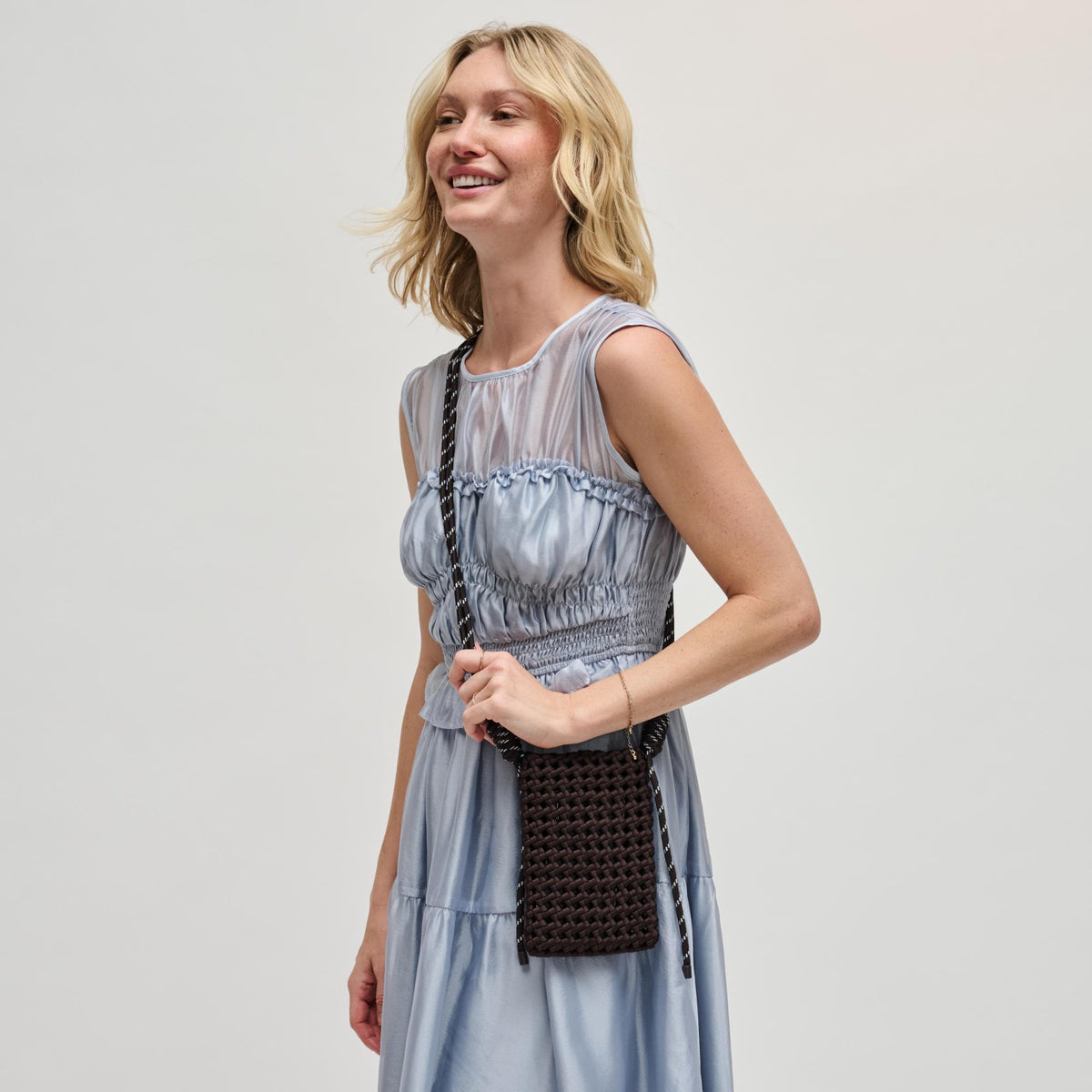 Woman wearing Chocolate Sol and Selene Eos Cell Phone Crossbody 841764113038 View 1 | Chocolate