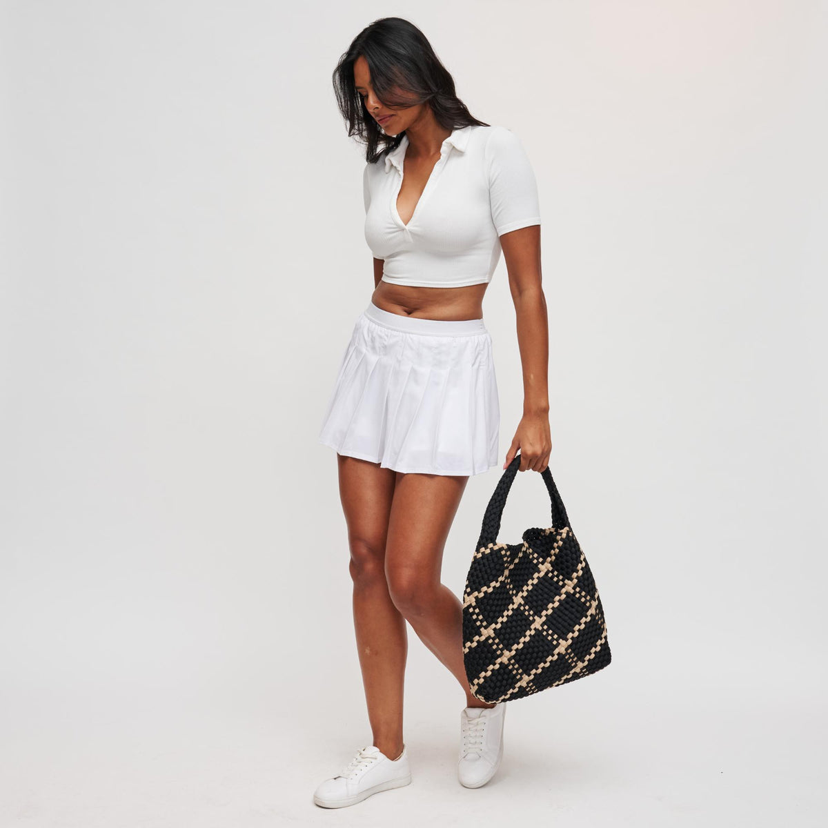 Woman wearing Black Nude Sol and Selene Celestial Woven Neoprene Hobo 841764112307 View 3 | Black Nude