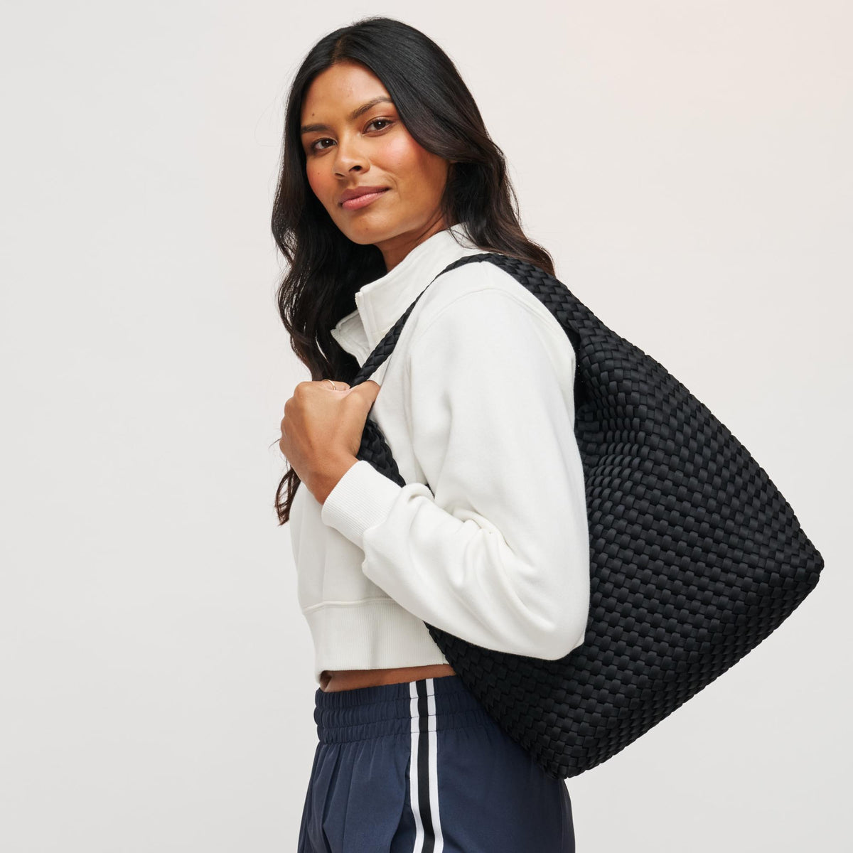 Woman wearing Black Sol and Selene Celestial Woven Neoprene Hobo 841764111201 View 2 | Black