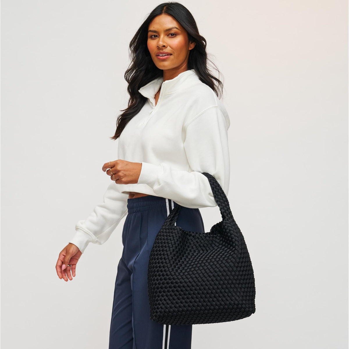 Woman wearing Black Sol and Selene Celestial Woven Neoprene Hobo 841764111201 View 1 | Black