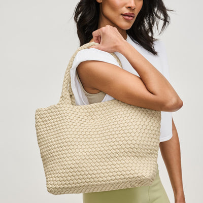 Woman wearing Beige Sol and Selene Sky's The Limit - Medium Laced Up Eco-Edition Tote 841764111584 View 1 | Beige