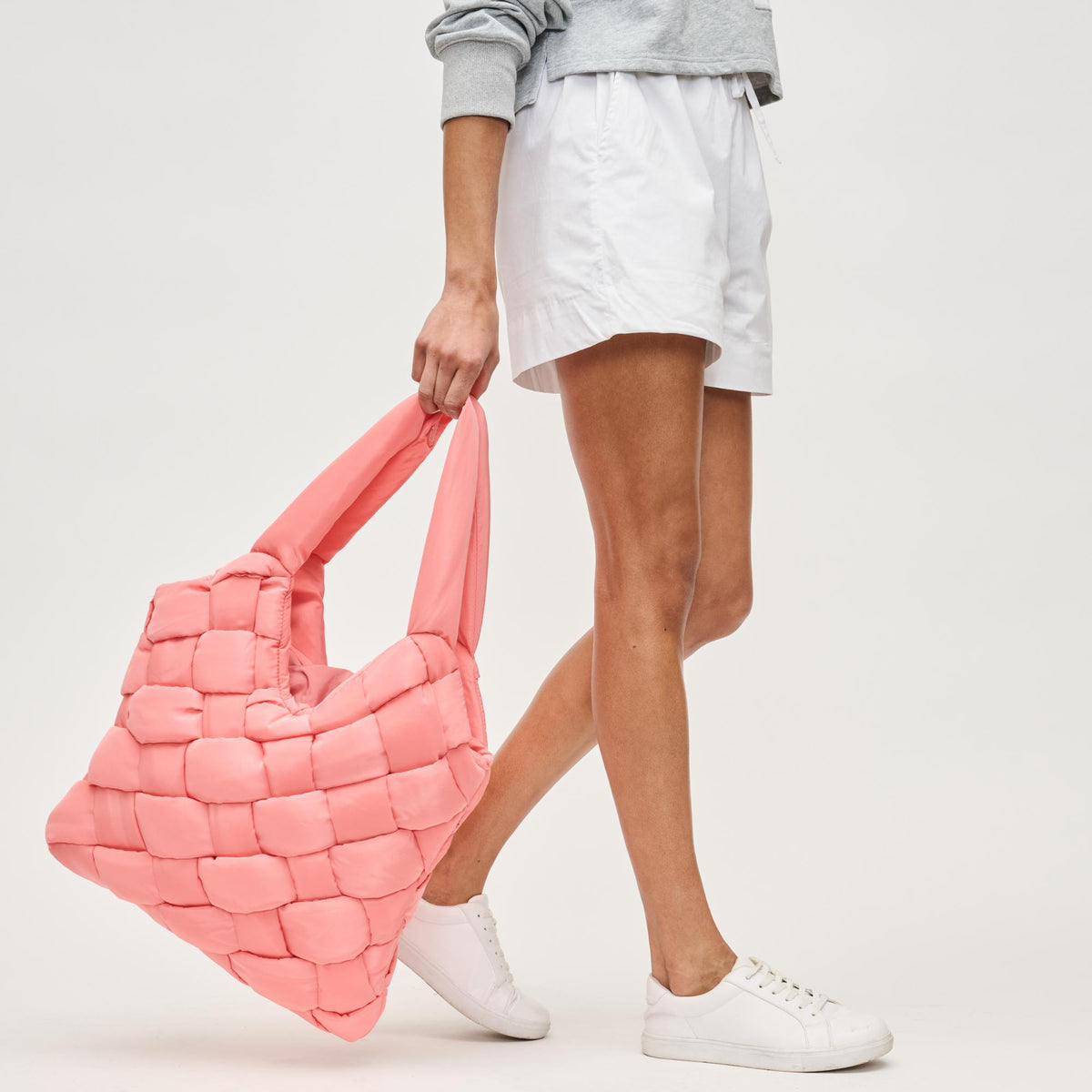 Woman wearing Salmon Sol and Selene Illumine Tote 841764111935 View 2 | Salmon