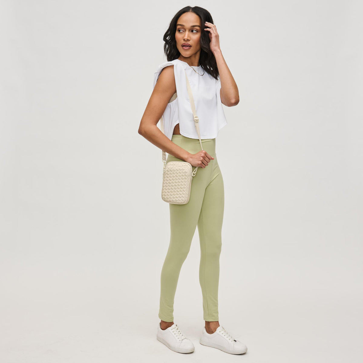 Woman wearing Cream Sol and Selene Divide & Conquer - Woven Neoprene Crossbody 841764109239 View 2 | Cream