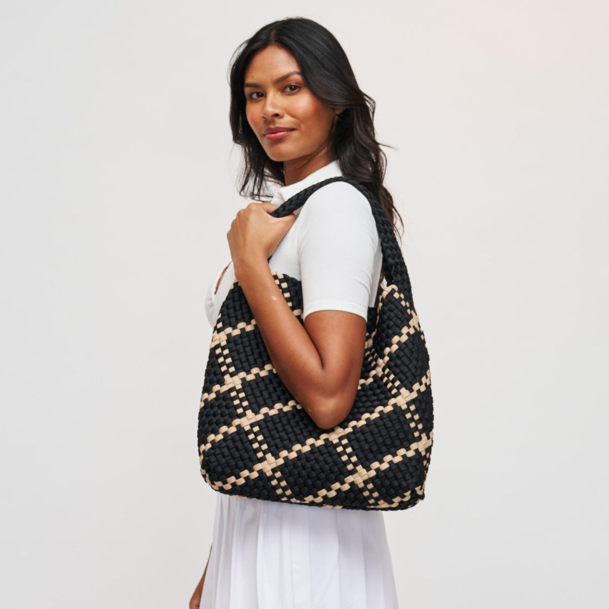 Woman wearing Black Nude Sol and Selene Celestial Woven Neoprene Hobo 841764112307 View 2 | Black Nude