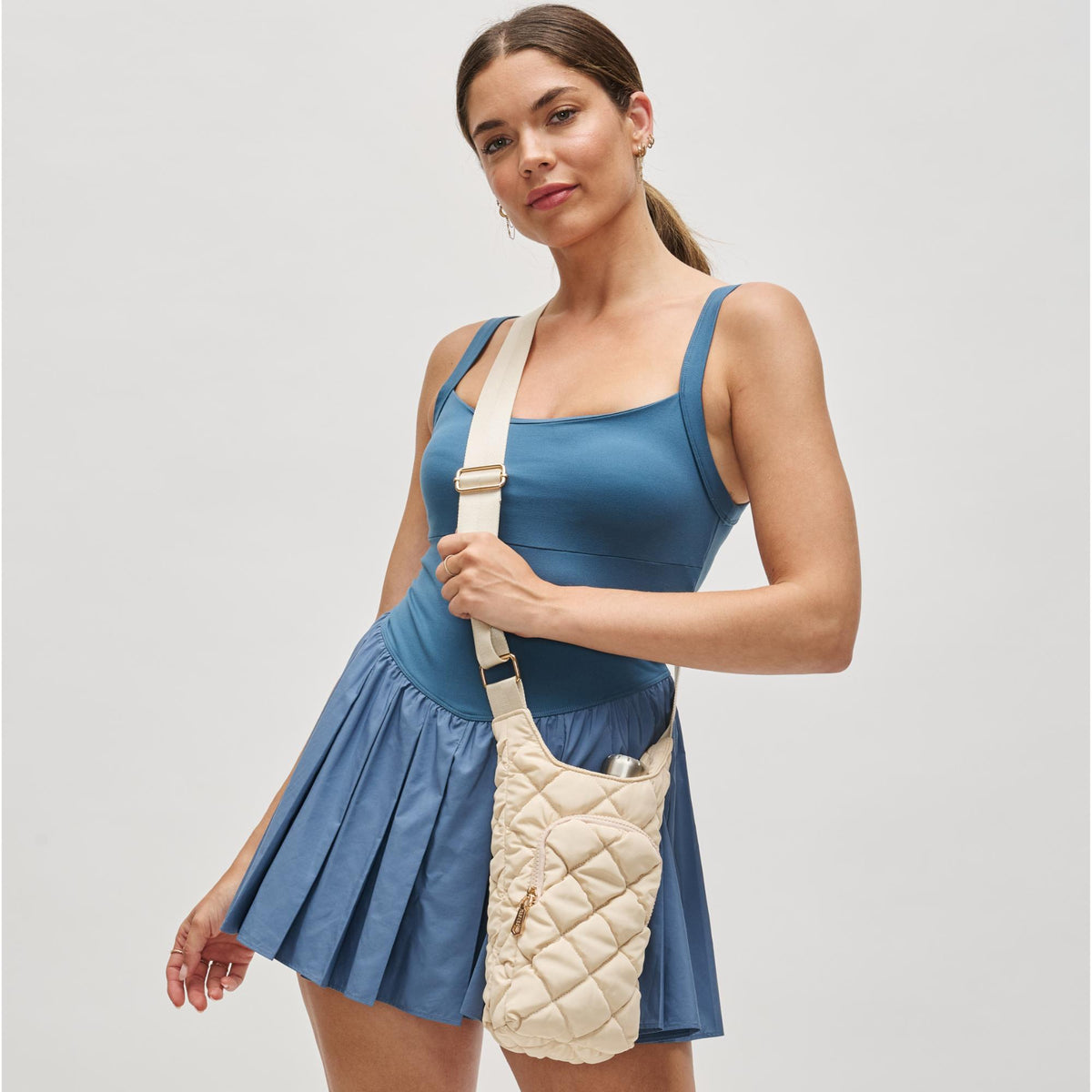 Woman wearing Cream Sol and Selene Let It Flow - Puffer Crossbody 841764112079 View 1 | Cream