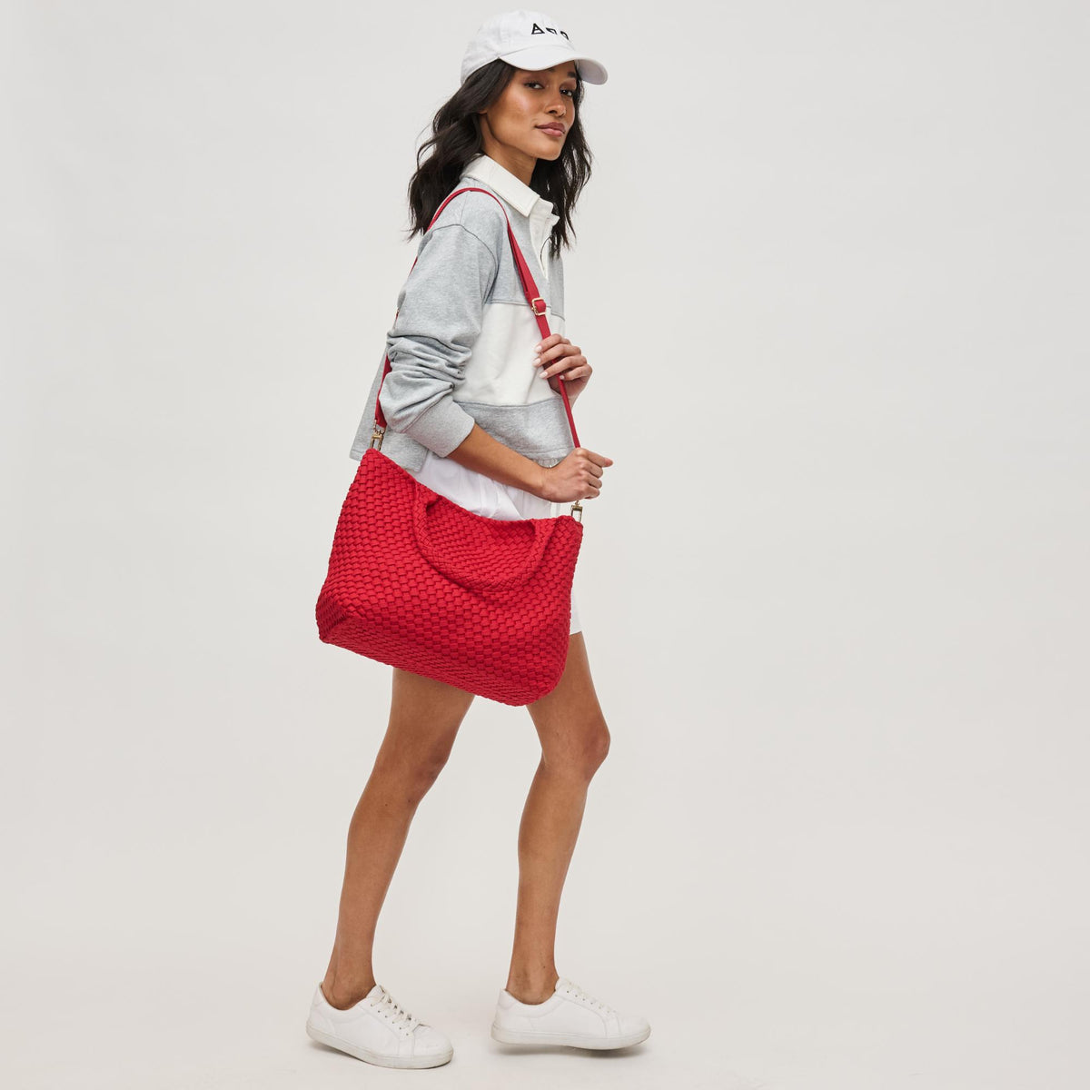 Woman wearing Red Sol and Selene Sky's The Limit - Medium Laced Up Eco-Edition Tote 841764111645 View 4 | Red