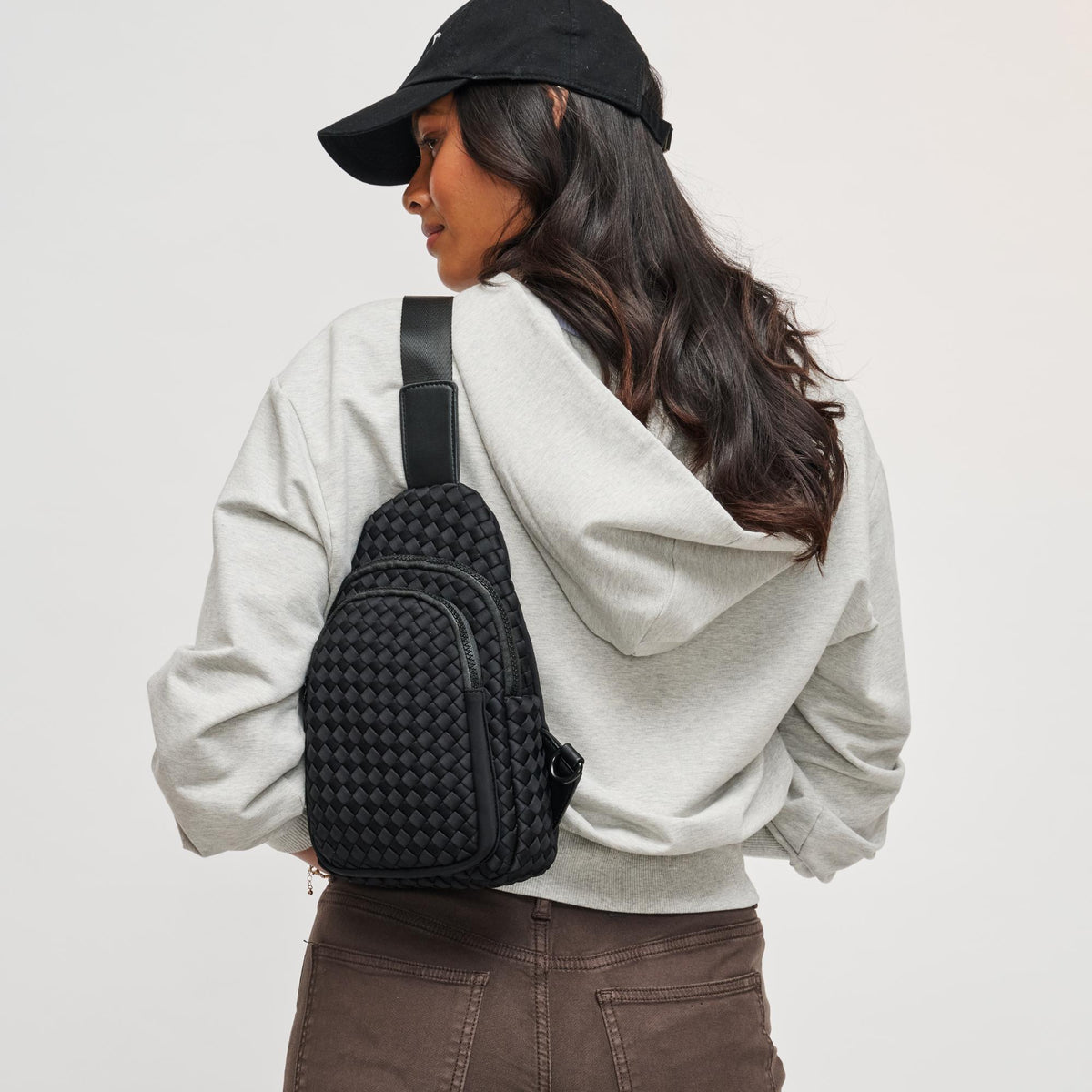 Woman wearing Black Sol and Selene Beyond The Horizon - Woven Neoprene Sling Backpack 841764108034 View 1 | Black