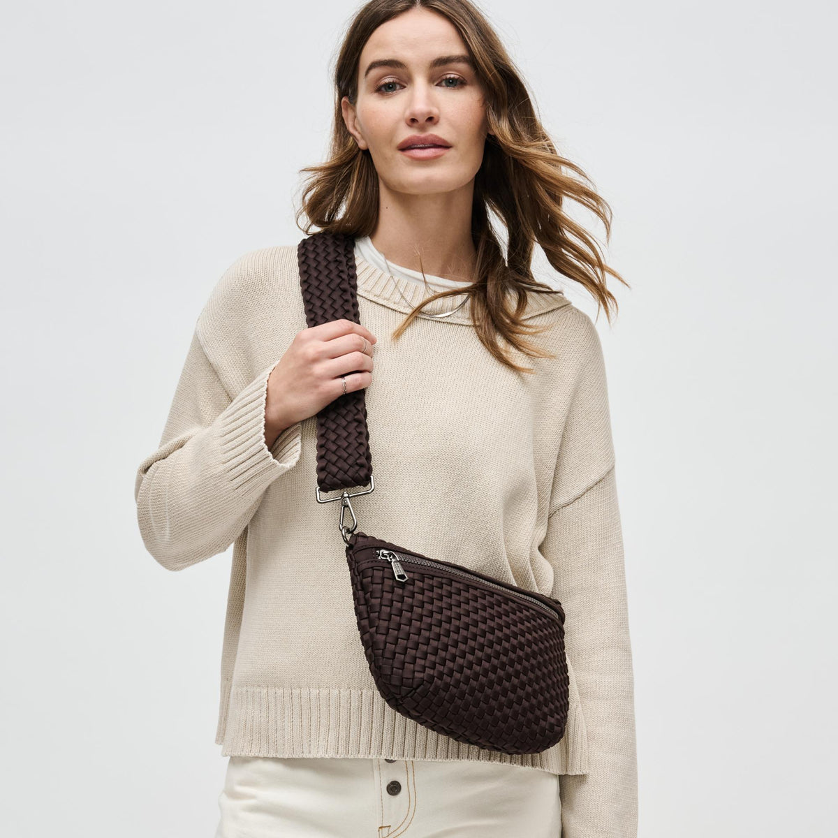 Woman wearing Chocolate Sol and Selene Ethereal - Woven Neoprene Crossbody 841764110853 View 1 | Chocolate