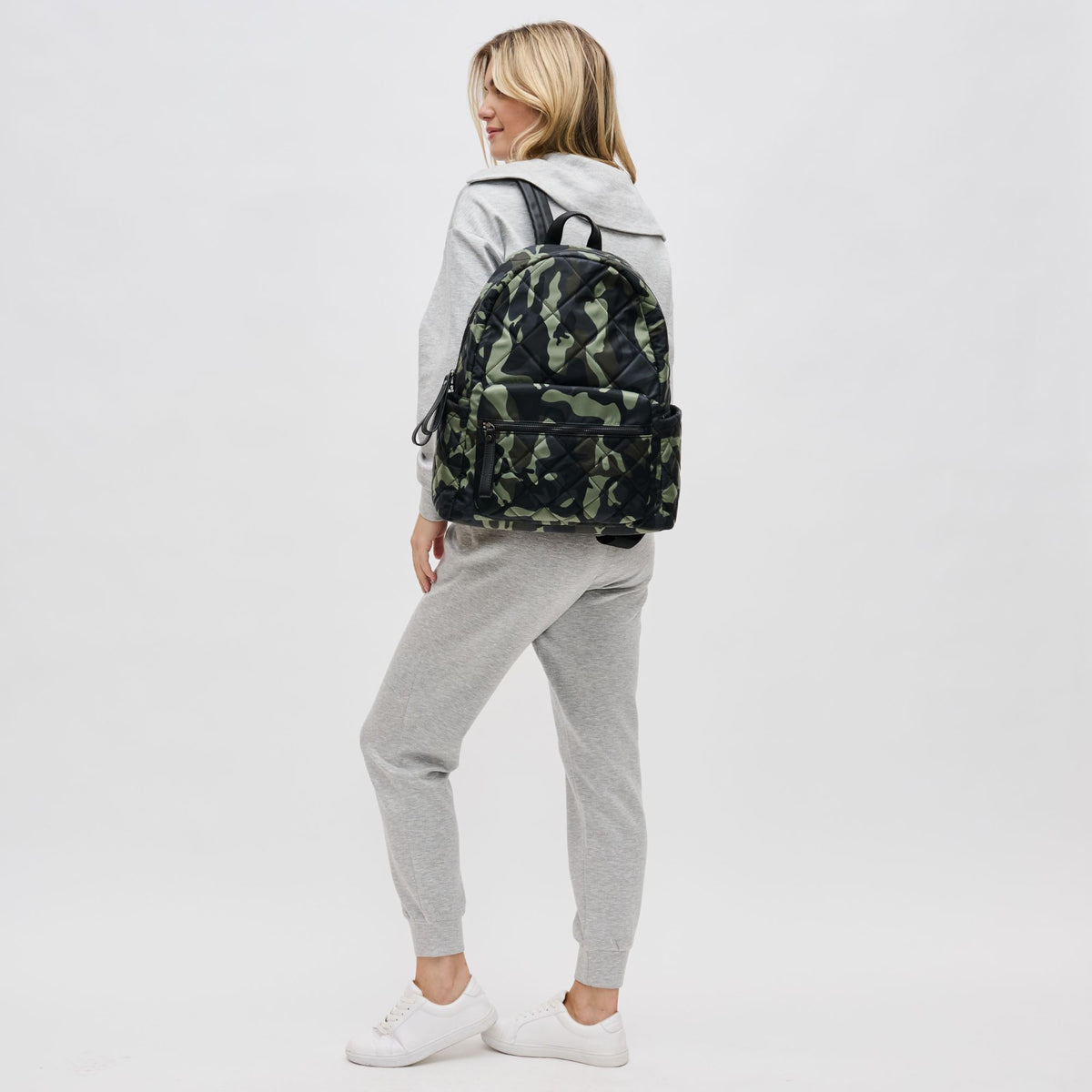 Woman wearing Camo Sol and Selene Motivator - Large Travel Backpack 841764106580 View 3 | Camo