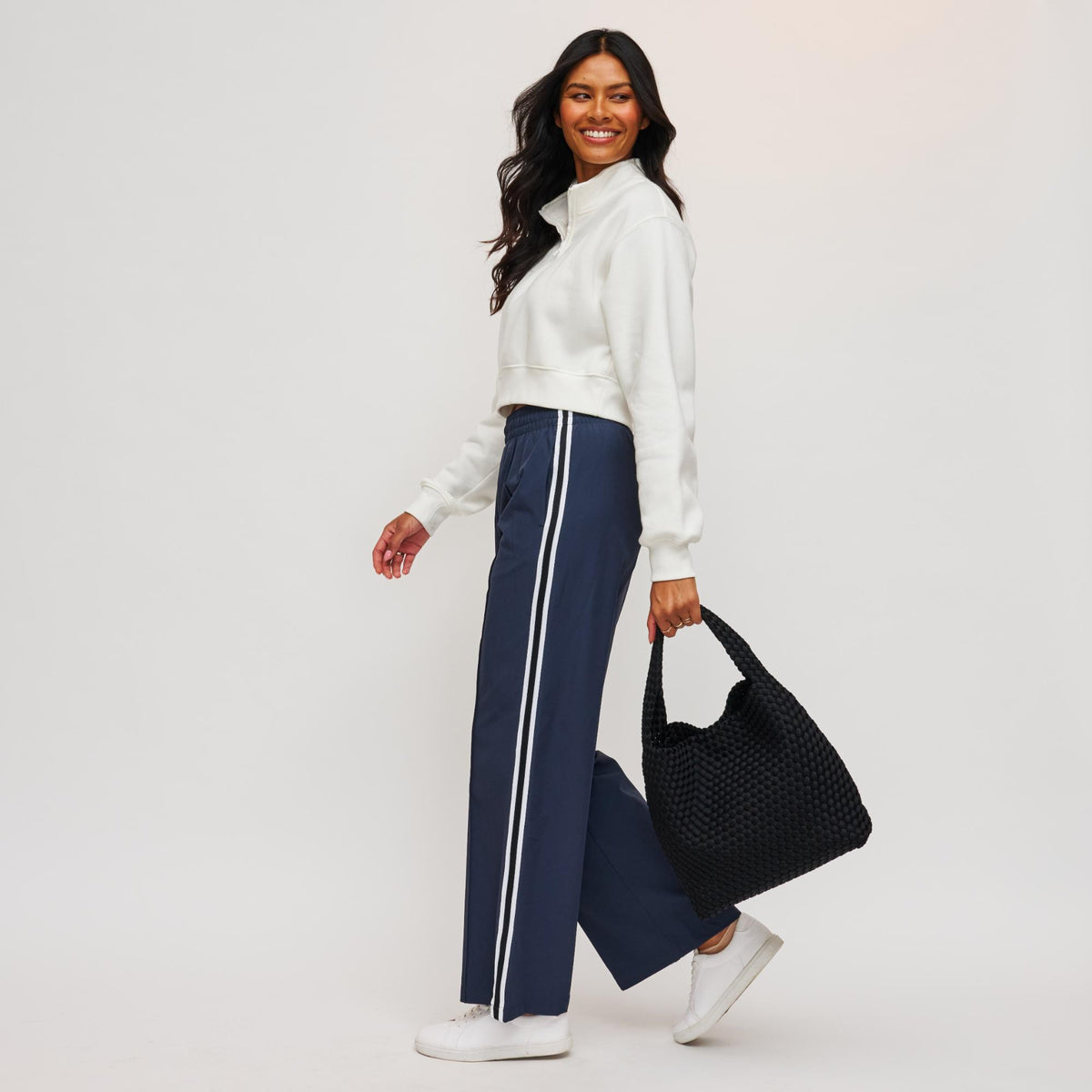 Woman wearing Black Sol and Selene Celestial Woven Neoprene Hobo 841764111201 View 3 | Black