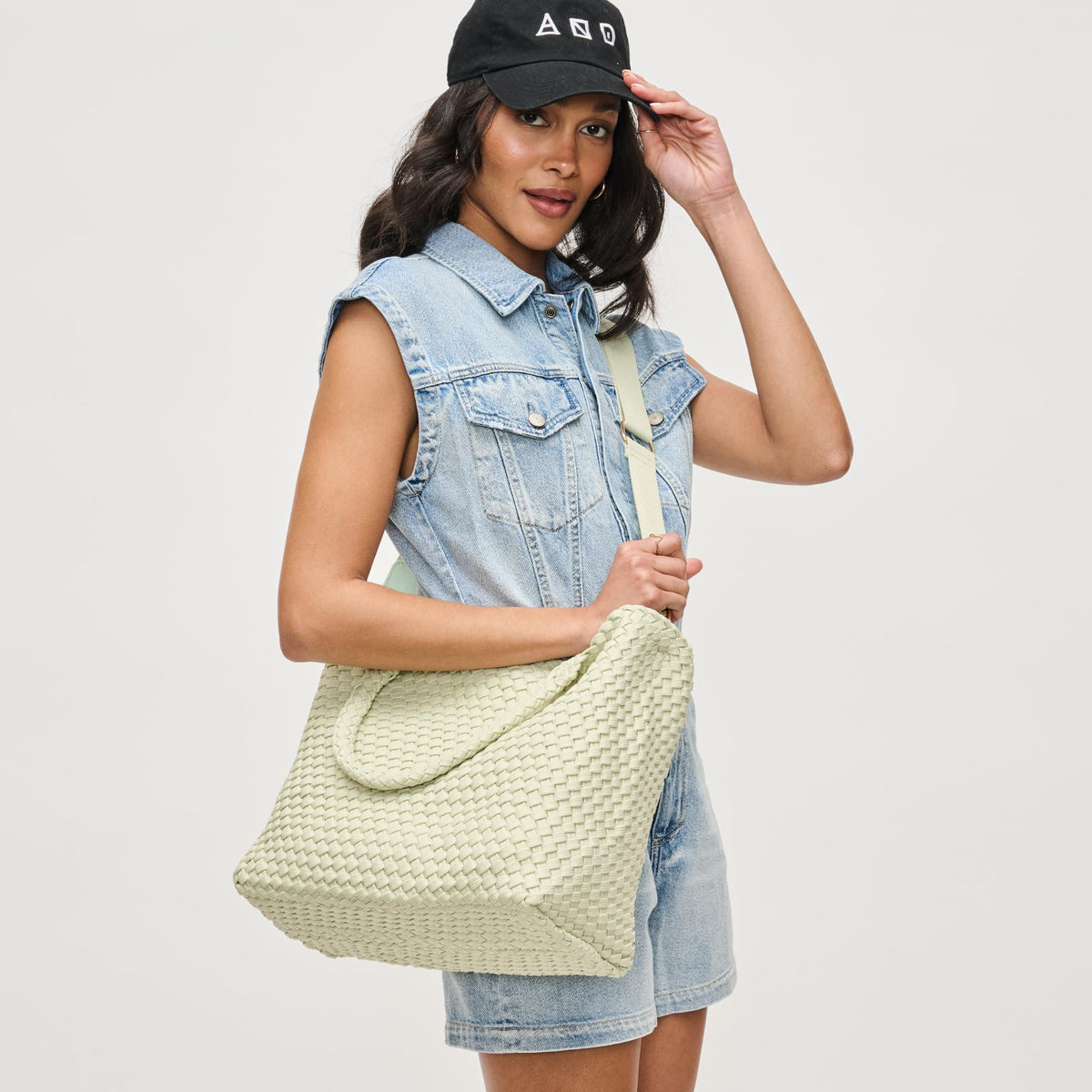 Woman wearing Pistachio Sol and Selene Sky's The Limit - Medium Laced Up Eco-Edition Tote 841764111638 View 3 | Pistachio