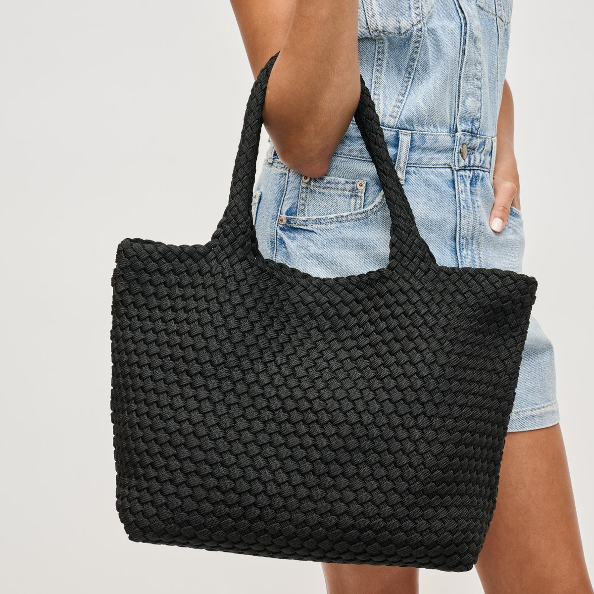 Woman wearing Black Sol and Selene Sky's The Limit - Medium Laced Up Eco-Edition Tote 841764111591 View 2 | Black