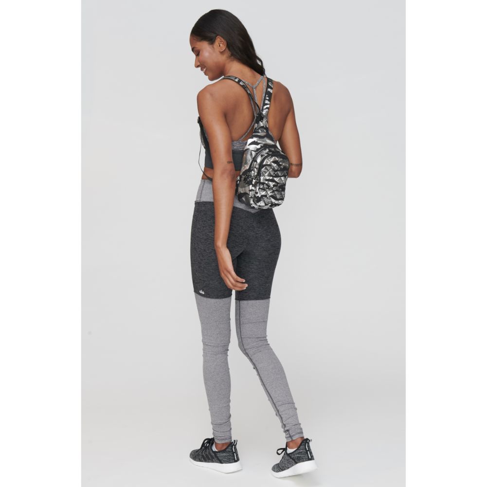 Woman wearing Silver Metallic Camo Sol and Selene On The Run Sling Backpack 841764104432 View 1 | Silver Metallic Camo