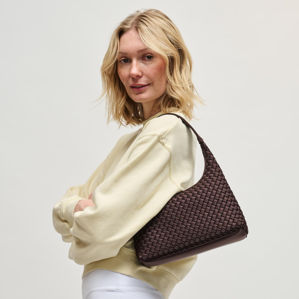 Woman wearing Chocolate Sol and Selene Harmonia - Woven Neoprene Shoulder Bag 841764112536 View 4 | Chocolate
